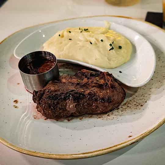6-oz Filet Mignon with Red Wine Signature Steakhouse 71 sauce and Garlic Mashed Potatoes