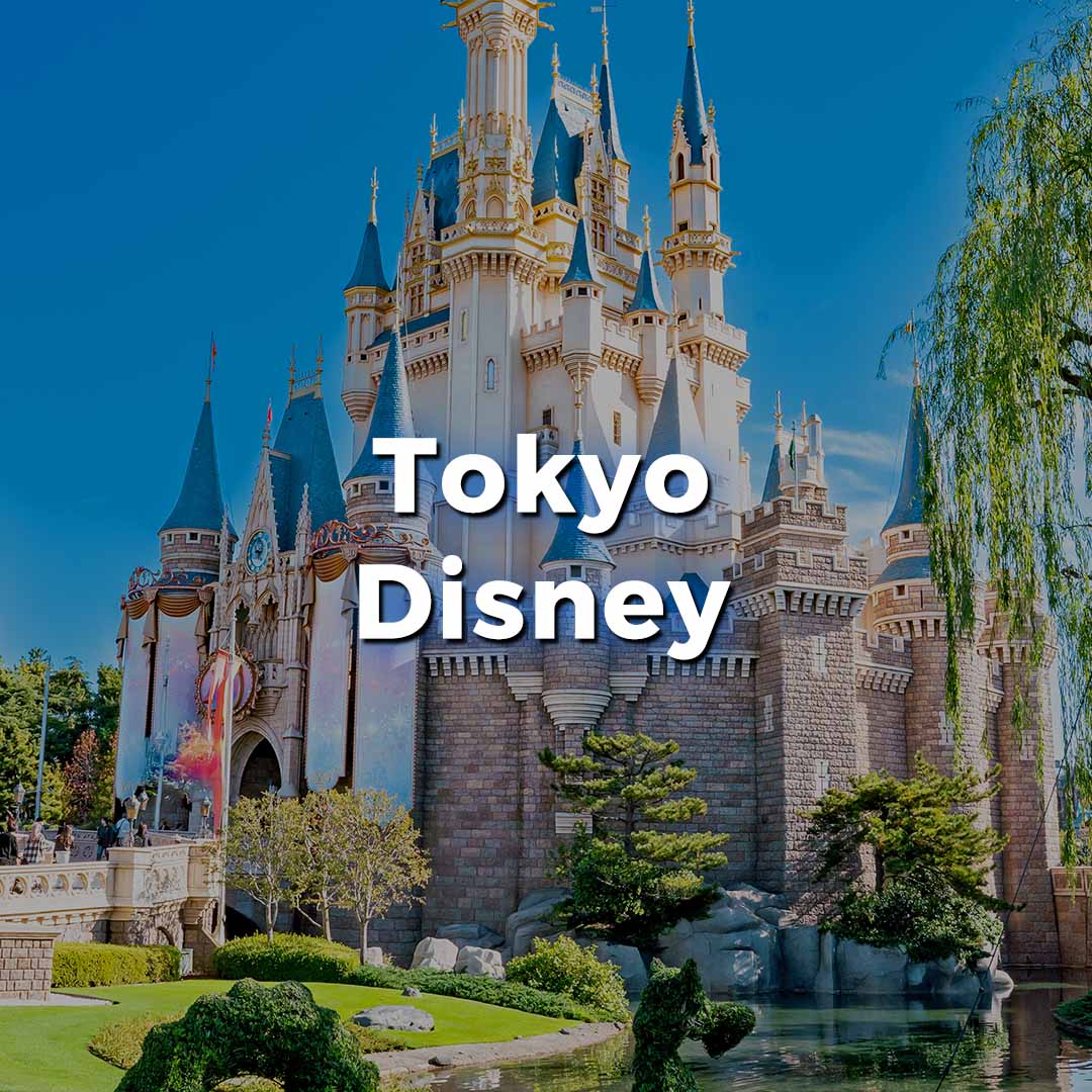 Tokyo Disney Cinderella Castle with text overlay "Tokyo Disney". Image is a link to the MouseWatcher page for Tokyo Disney restaurants.